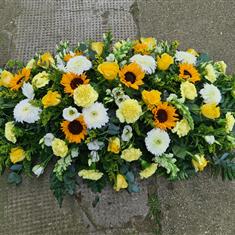 Golden farewell casket spray 