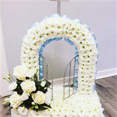 gates of heaven with roses and lisianthus 