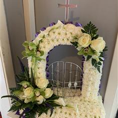 gates of heaven with orchids and calla lilys 