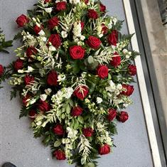 Red and white country garden casket spray 