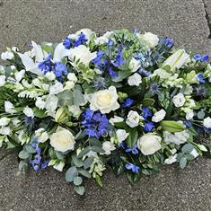 Serenity blue and white casket spray 